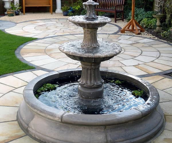 Two tiered Barcelona fountain in a small Cambridge double pool surround