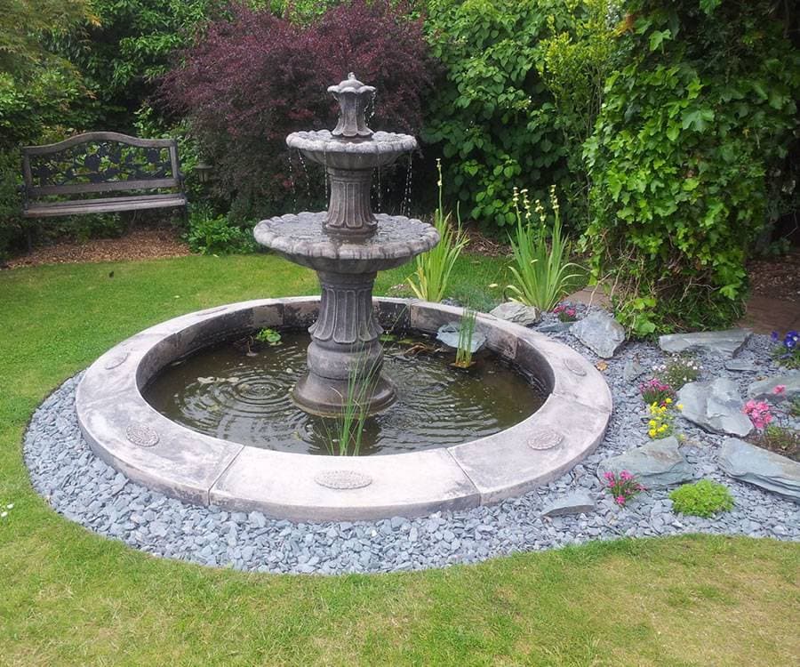 Two tiered Barcelona fountain in a Laurel single pool surround